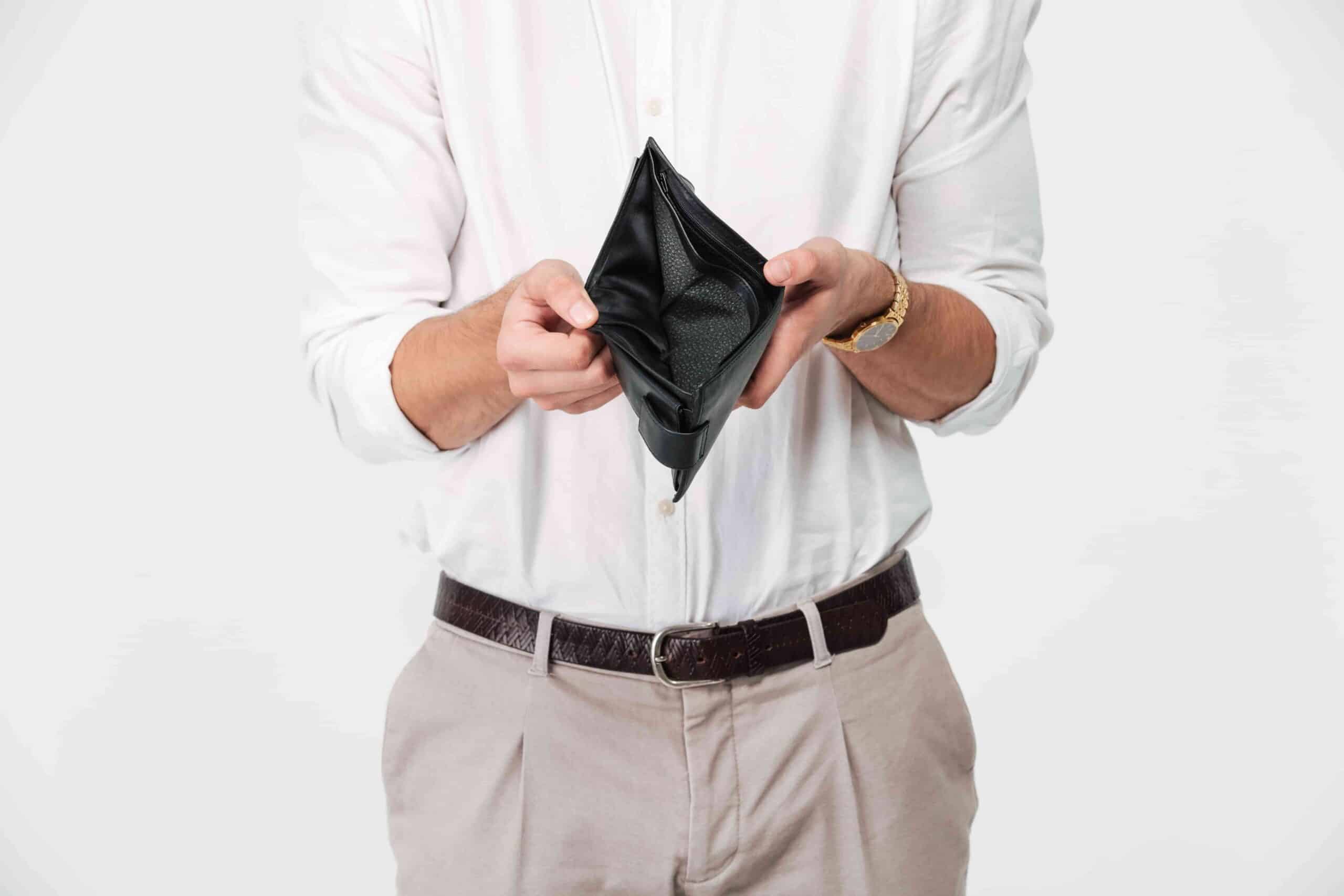 fitness coach opening empty wallet showing why fitness coach followers don't buy